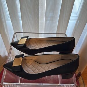 Cole Haan pumps with bow detail.